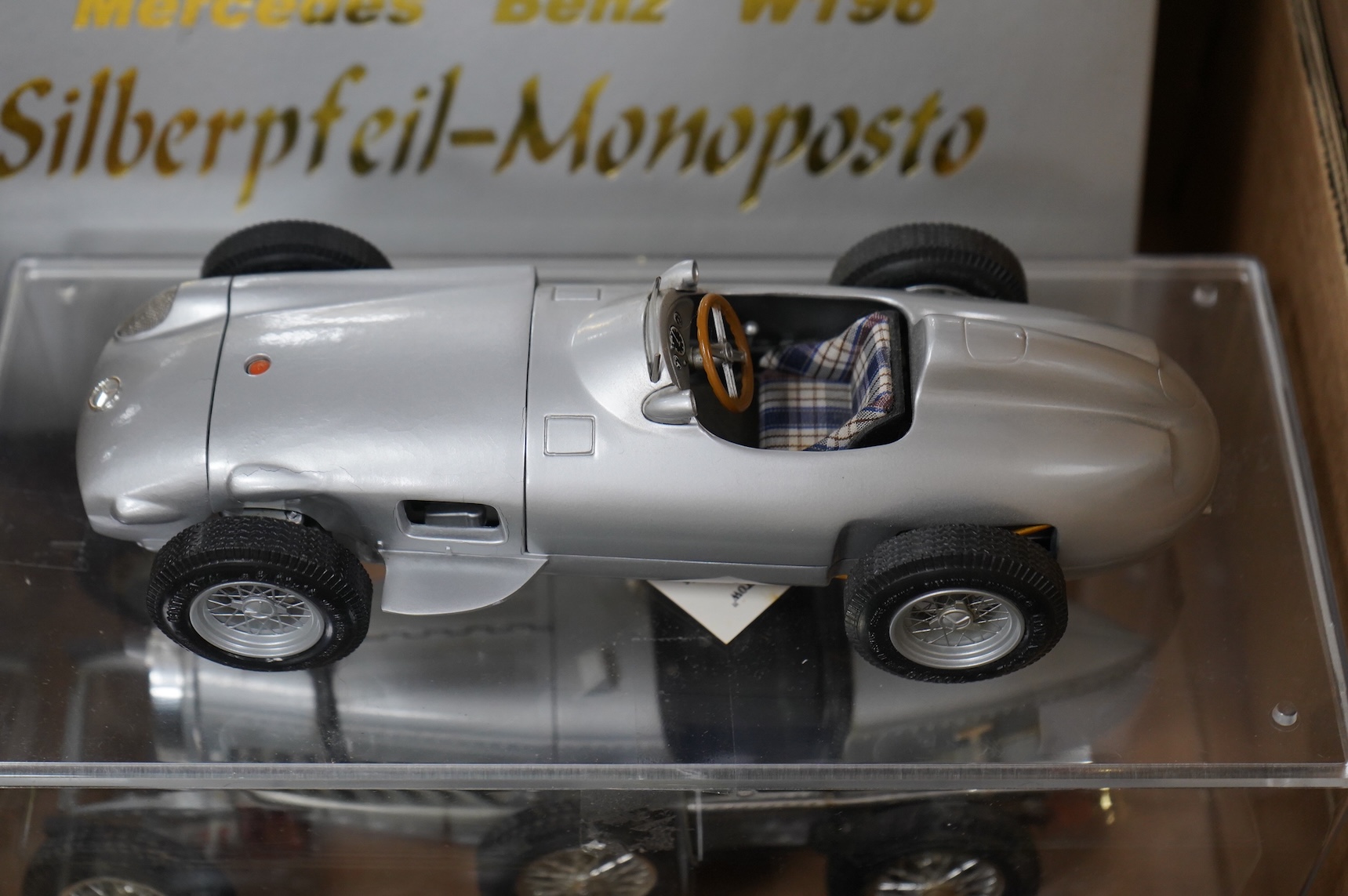 A collection of diecast vehicles, including a boxed CMC 1:18 scale Mercedes Benz W196 1950s single seat racing car, together with five boxed early Matchbox Models of Yesteryear, two Atlas Dinkies, a 1:18 scale Bburago Bu